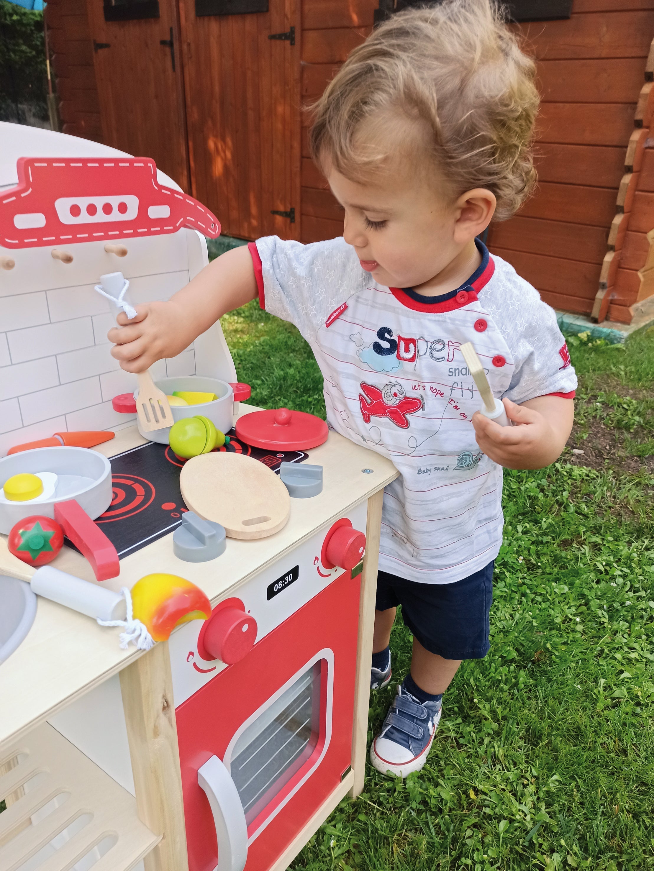 8 piece Red wooden play kitchen.
